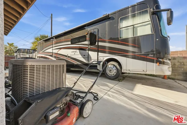 an aerial view of a house with a swimming pool