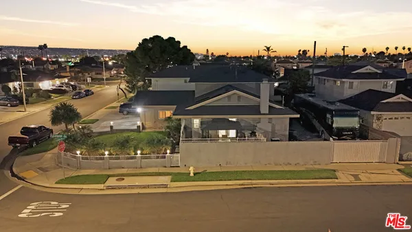 a kitchen with stainless steel appliances granite countertop wooden floors sink and cabinets