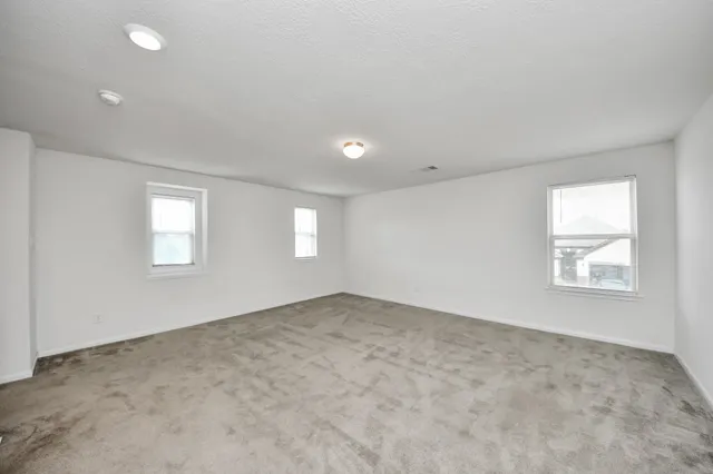 an empty room with windows