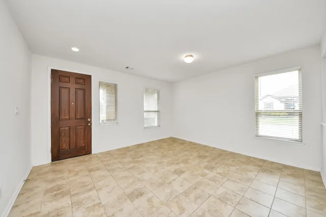a view of an empty room and window