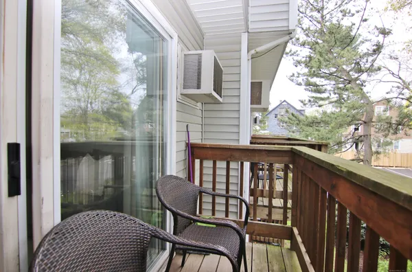 a view of a chair and table in the balcony