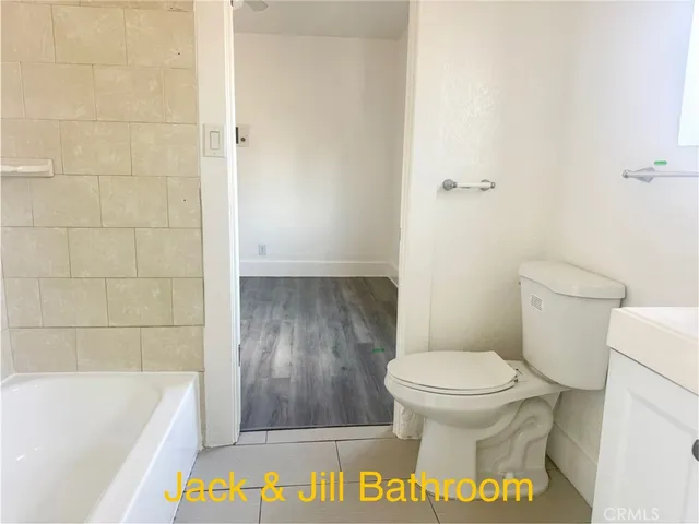 a bathroom with a toilet and a bathtub