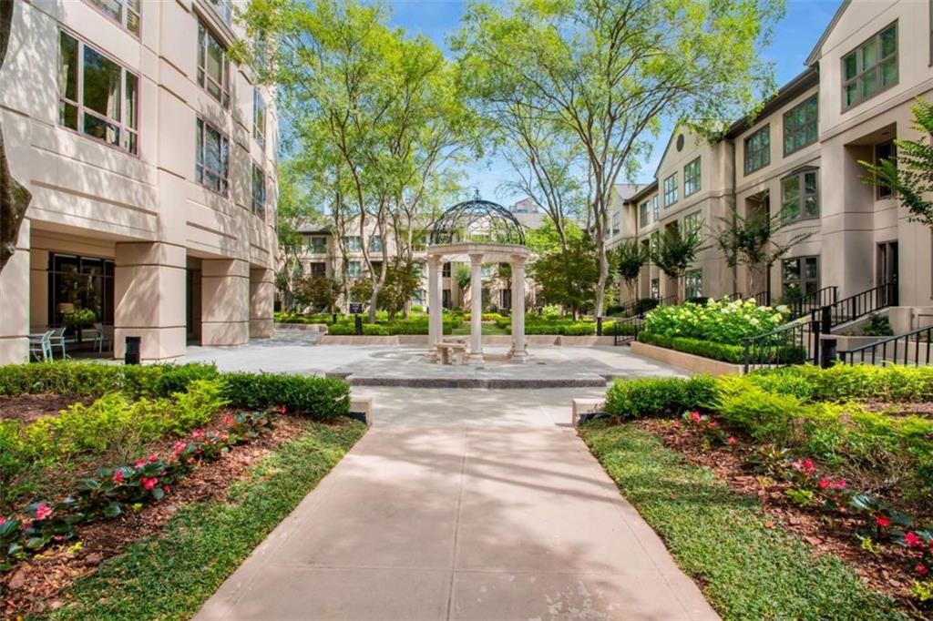 3475 Oak Valley Road Northeast, Unit 1630 Atlanta, GA 30326 - Photo 3 of 38 a view of a building with garden