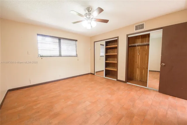 a bathroom with a sink mirror vanity and toilet