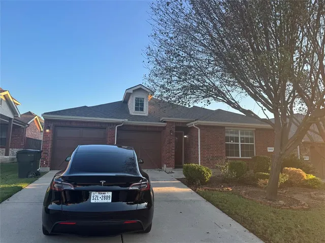 a car parked in front of a house