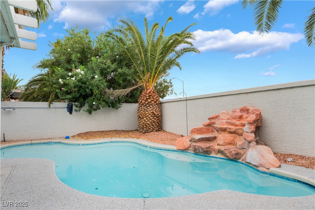 3695 Funston Way Las Vegas, NV 89129 - Photo 2 of 43 View of swimming pool featuring a fenced backyard