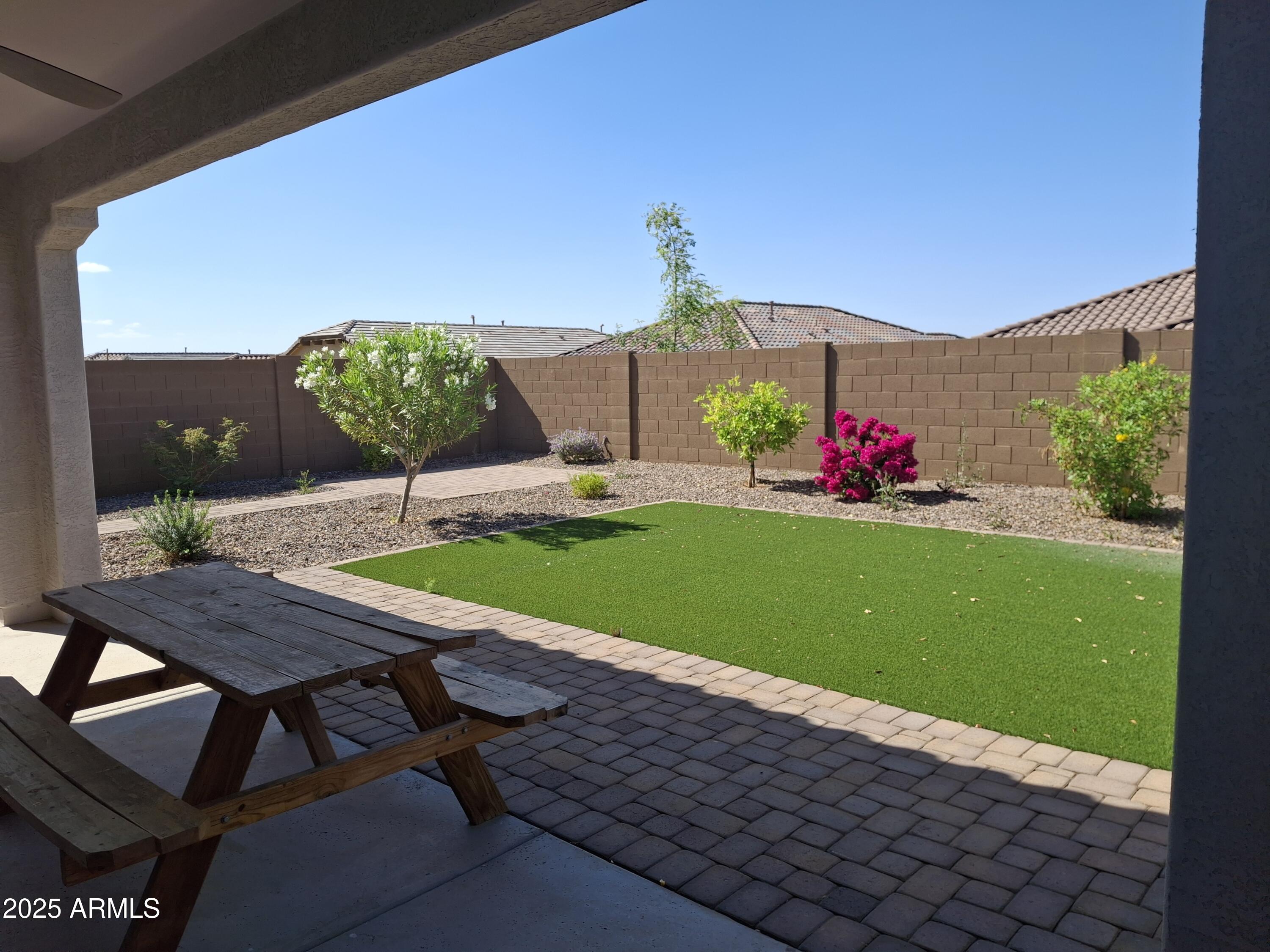 1536 West Corral Road Phoenix, AZ 85041 - Photo 15 of 16 a view of a patio with table and chairs and potted plants