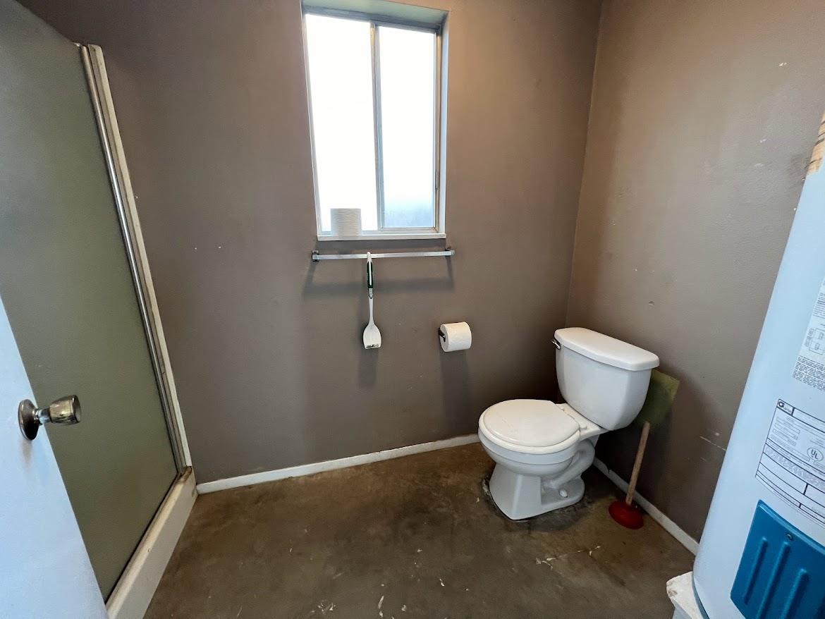 16109 East Manning Reedley, CA 93654 - Photo 26 of 30 a white toilet sitting in a bathroom