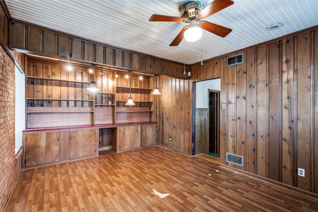 813 19th Street Plano, TX 75074 - Photo 7 of 12 a view of empty room with a ceiling fan and wooden floor