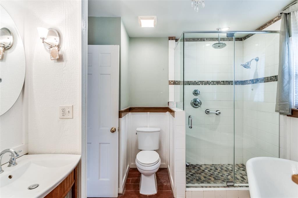 813 19th Street Plano, TX 75074 - Photo 8 of 12 a bathroom with a sink toilet and shower