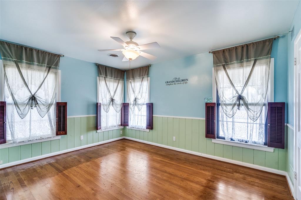813 19th Street Plano, TX 75074 - Photo 9 of 12 an empty room with wooden floor fan and windows