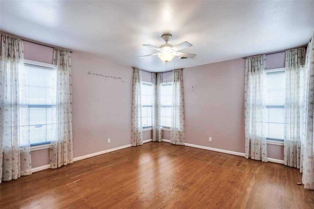 813 19th Street Plano, TX 75074 - Photo 10 of 12 wooden floor in an empty room with a window