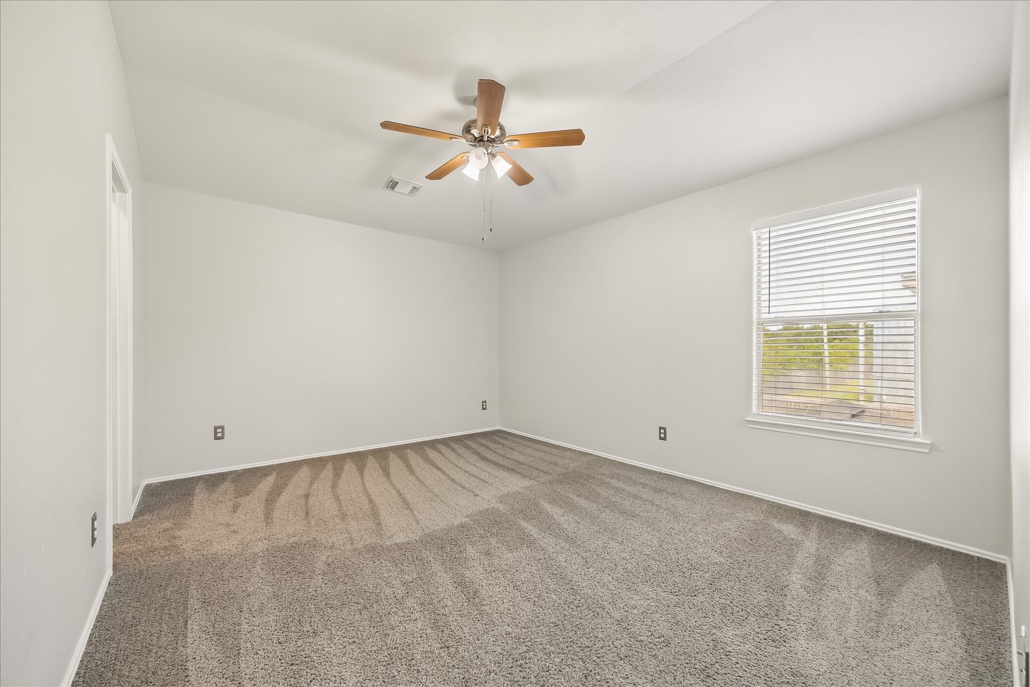 223 Sunset Colony Drive Rosharon, TX 77583 - Photo 29 of 50 They will rest comfortably in this roomy guest bedroom with soft neutral carpet, fresh paint, a cooling ceiling fan, a large closet and easy access to the upstairs full bath.