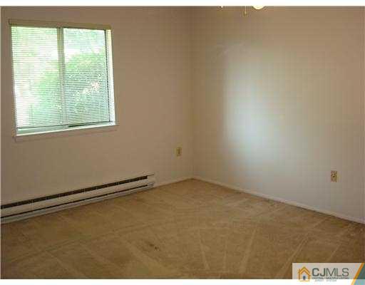 716 B Delair Road Monroe Township, NJ 08831 - Photo 13 of 13 an empty room with a window