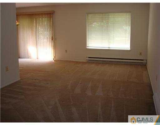 716 B Delair Road Monroe Township, NJ 08831 - Photo 6 of 13 a view of an empty room with a window