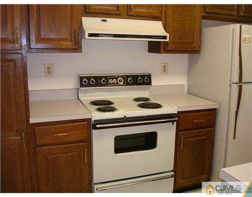 716 B Delair Road Monroe Township, NJ 08831 - Photo 8 of 13 a stove top oven sitting inside of a kitchen