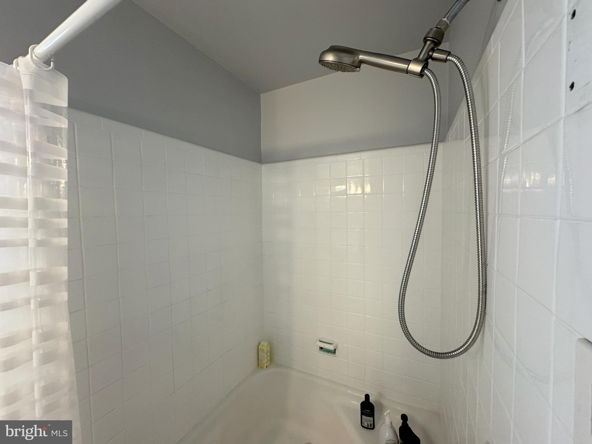 40 Old Lancaster Road, Unit 215 Merion Station, PA 19066 - Photo 15 of 23 Tub Shower in Hall Bathroom