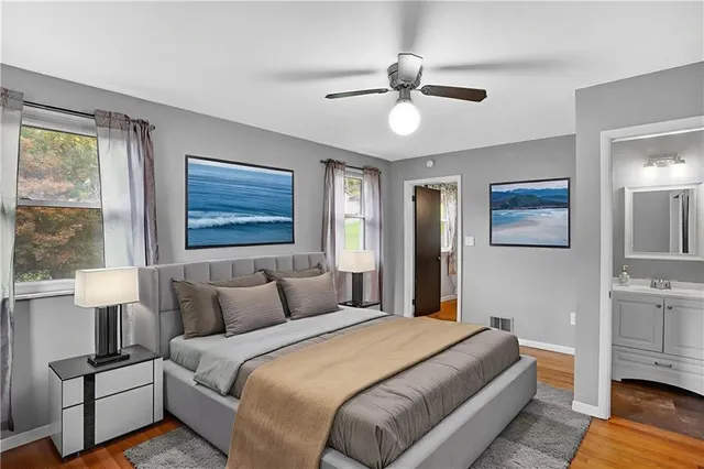 a bedroom with a large bed and a window