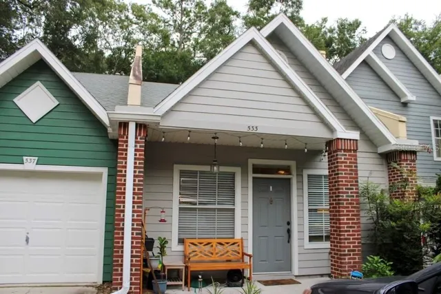 a front view of a house with garden