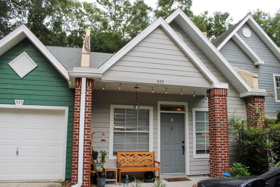 533 Northwest 50th Boulevard Gainesville, FL 32607 - Photo 1 of 19 a front view of a house with garden