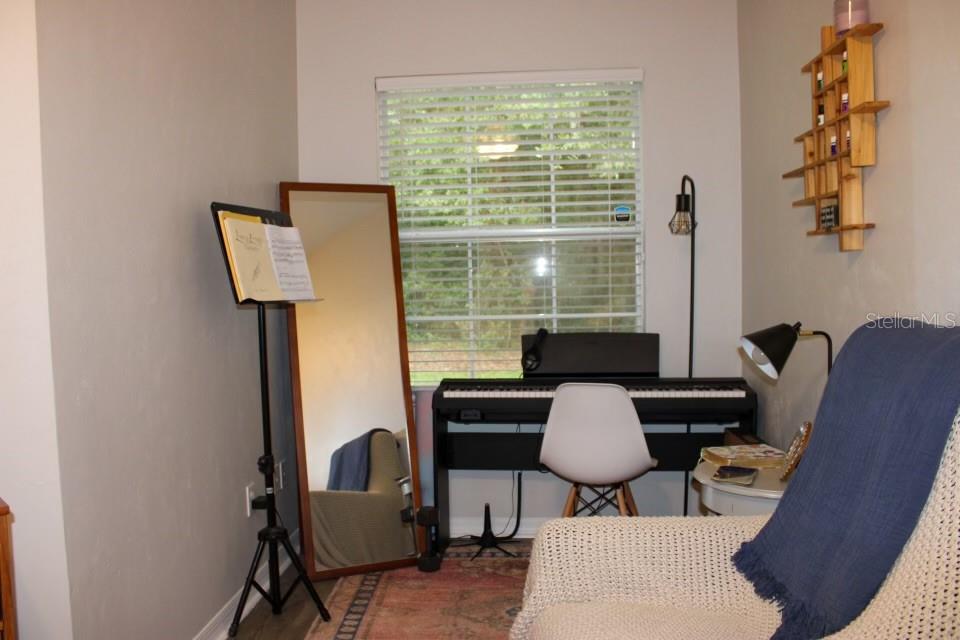 533 Northwest 50th Boulevard Gainesville, FL 32607 - Photo 11 of 19 a view of a workspace with furniture and a window
