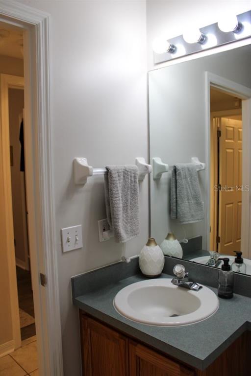 533 Northwest 50th Boulevard Gainesville, FL 32607 - Photo 17 of 19 a bathroom with a sink and a mirror