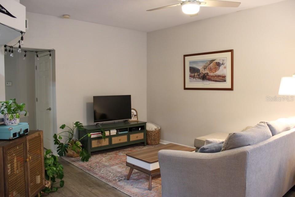 533 Northwest 50th Boulevard Gainesville, FL 32607 - Photo 3 of 19 a living room with furniture and a flat screen tv