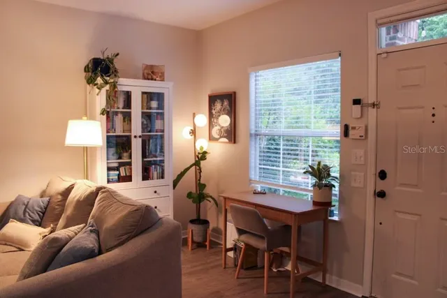 a living room with furniture and a window