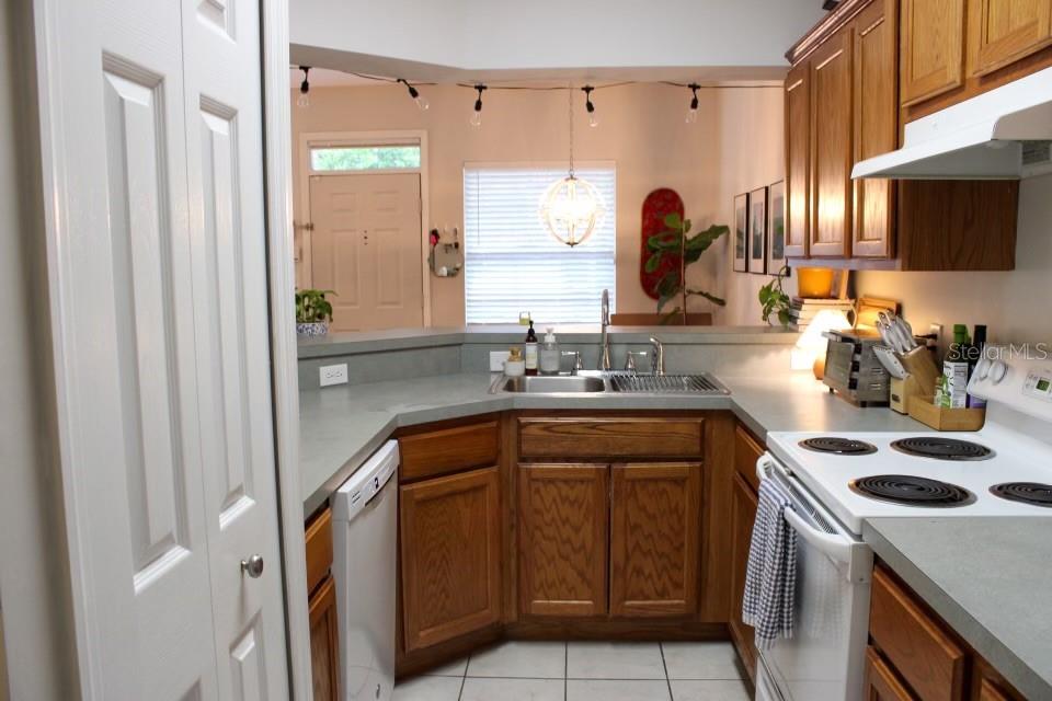 533 Northwest 50th Boulevard Gainesville, FL 32607 - Photo 7 of 19 a kitchen with stainless steel appliances a stove a sink and a microwave
