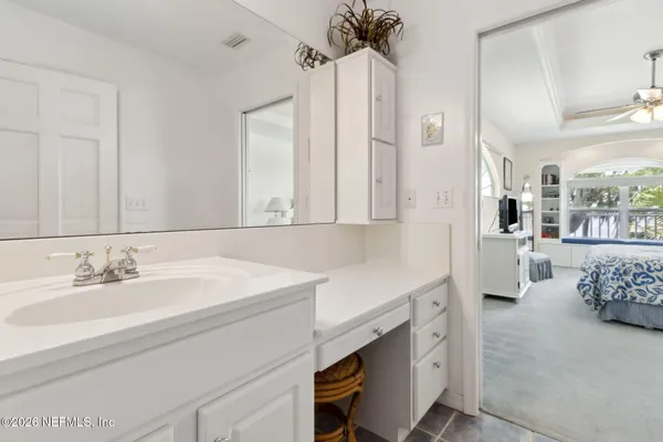a bathroom with a double vanity sink mirror and