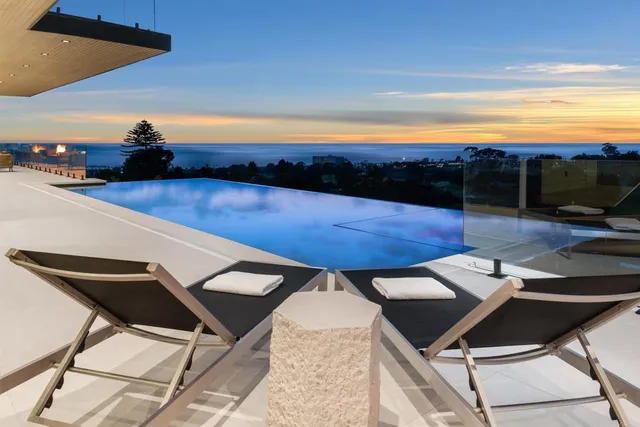 a view of a house with pool porch and furniture