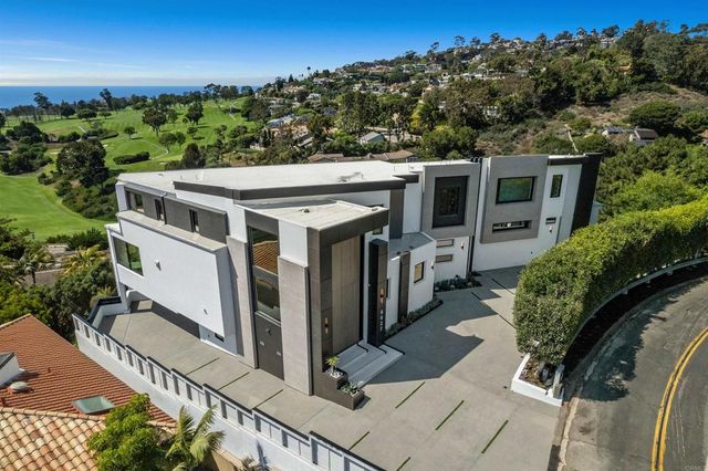 a view of a lobby with chair and door