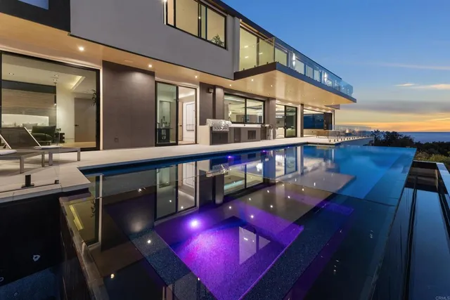 a view of a roof deck with couches and city view