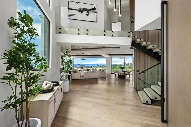 a kitchen with a sink stove and chairs
