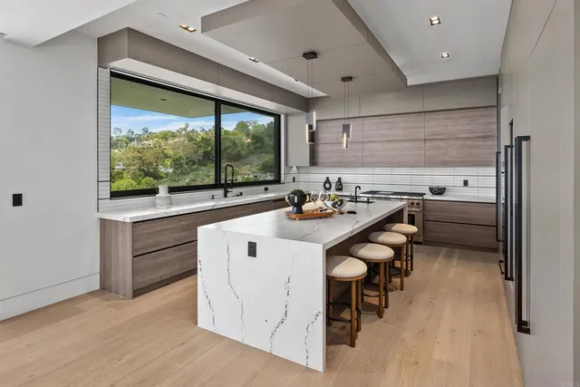 a kitchen with a sink and a window