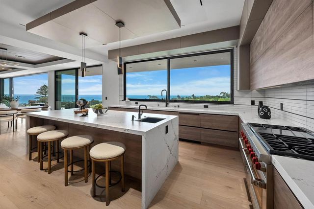 a view of a hallway with a chandelier