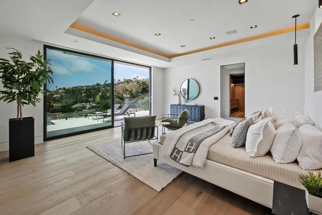 a living room with furniture gym equipment and a window