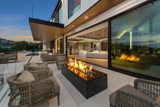 a front view of a house with a yard table and chairs