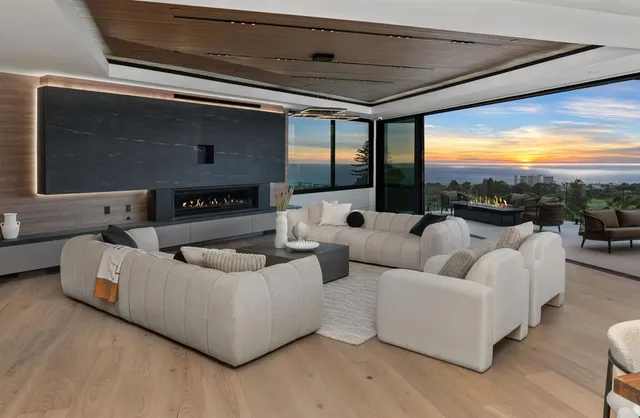 a view of a patio with table and chairs with wooden floor and fence