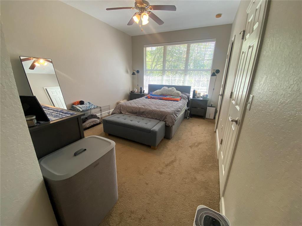 2508 Southwest 35th Place, Unit S111 Gainesville, FL 32608 - Photo 12 of 22 a bedroom with a bed and a window