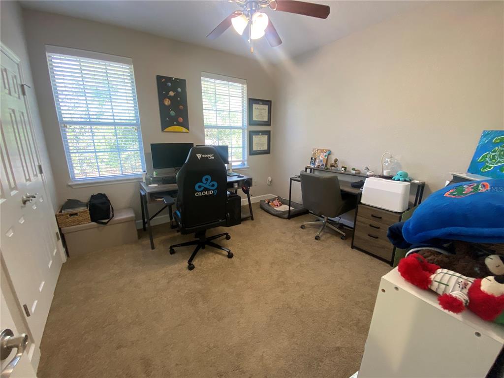 2508 Southwest 35th Place, Unit S111 Gainesville, FL 32608 - Photo 13 of 22 a workspace with furniture and a window