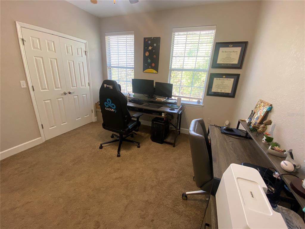 2508 Southwest 35th Place, Unit S111 Gainesville, FL 32608 - Photo 14 of 22 a work room with furniture and windows