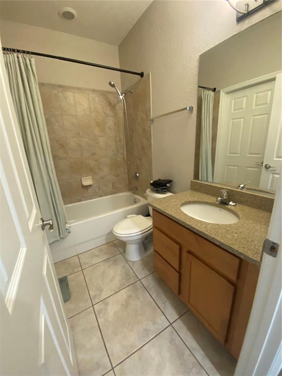 2508 Southwest 35th Place, Unit S111 Gainesville, FL 32608 - Photo 17 of 22 a bathroom with a granite countertop sink toilet and shower