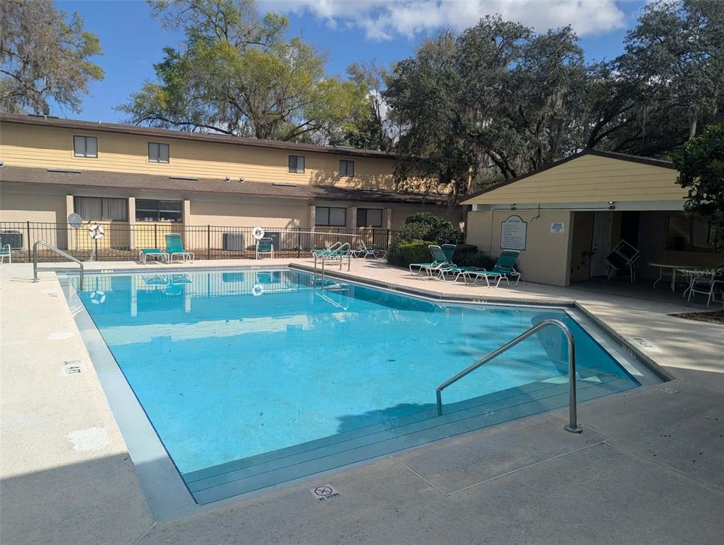 2508 Southwest 35th Place, Unit S111 Gainesville, FL 32608 - Photo 6 of 22 an outdoor view of house with swimming pool and furniture