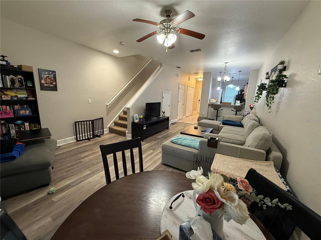 2508 Southwest 35th Place, Unit S111 Gainesville, FL 32608 - Photo 9 of 22 a living room with furniture and wooden floor