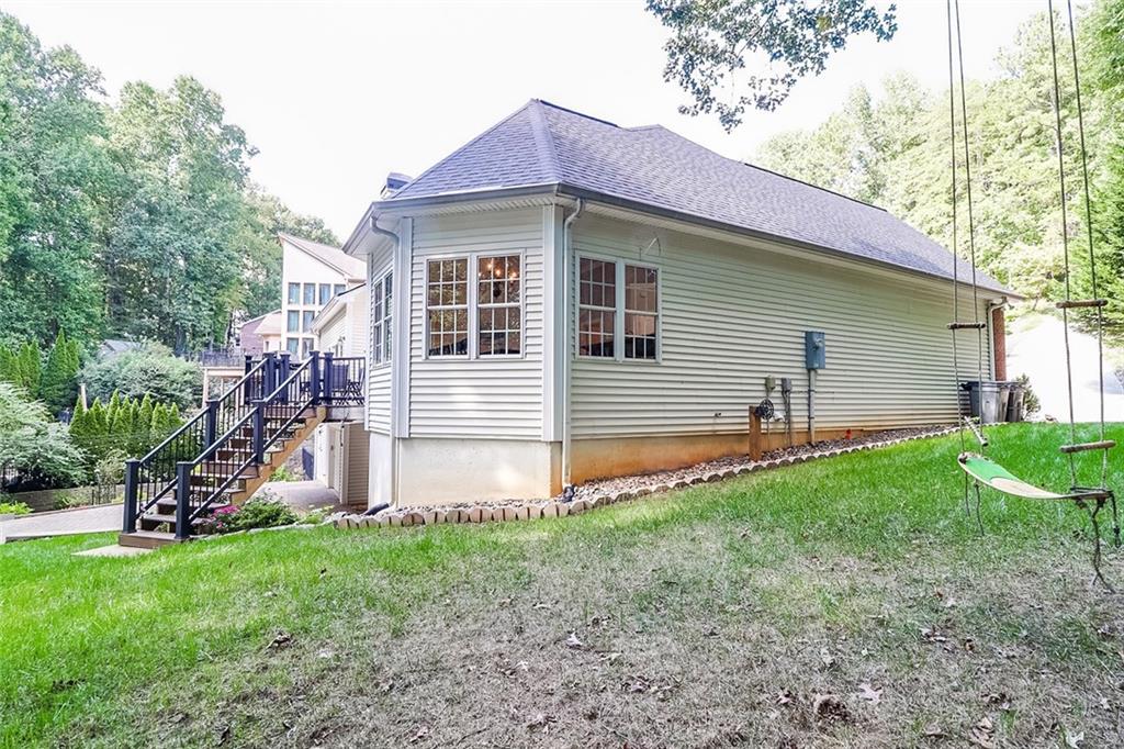 6150 Six Mile Cove Road Cumming, GA 30041 - Photo 21 of 27 a front view of a house with garden