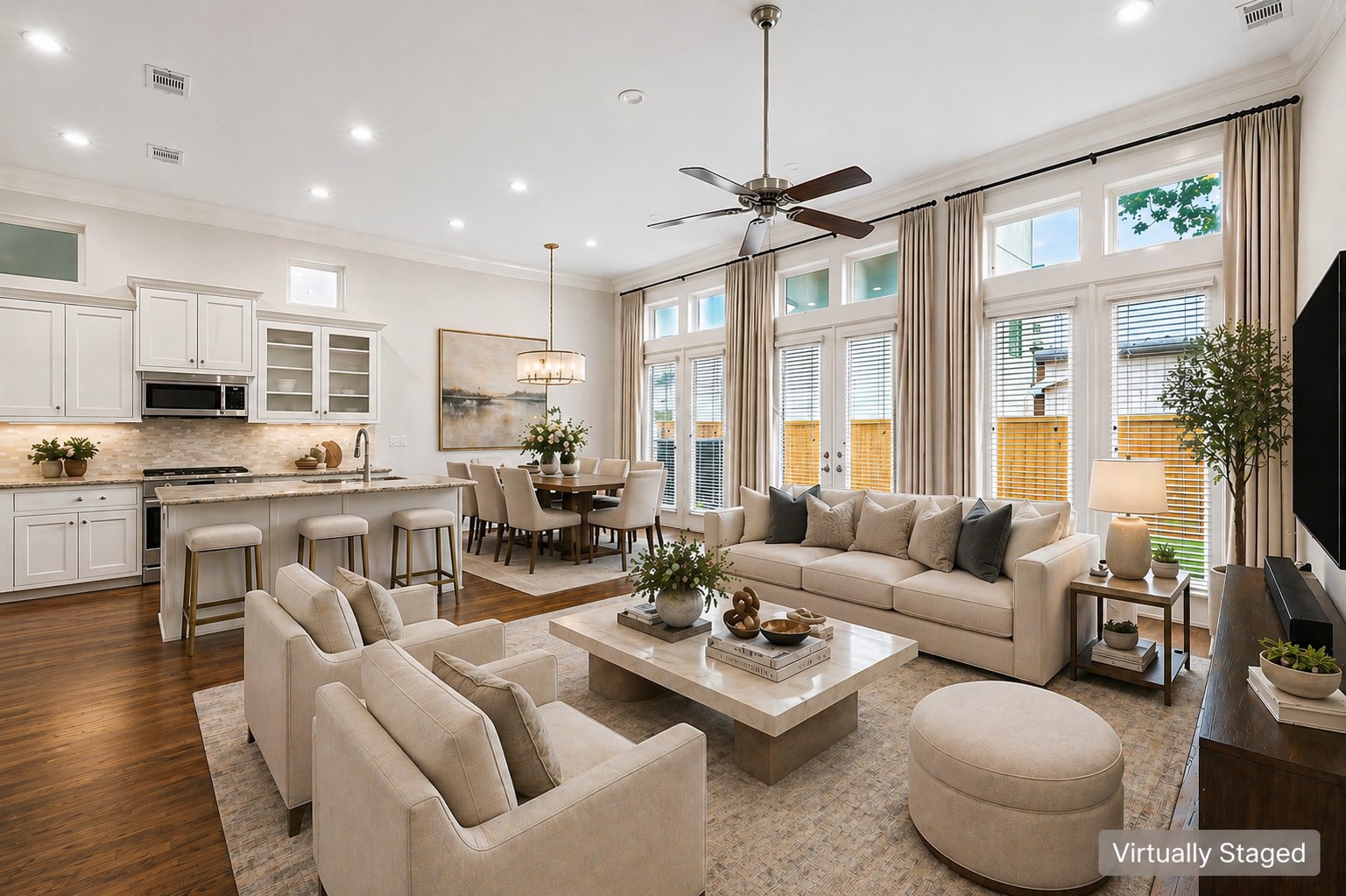 5621 Cohn Meadow Lane Houston, TX 77007 - Photo 3 of 35 Light-filled first-floor living space with soaring ceilings, rich hardwood floors, and seamless open-concept design connecting the kitchen and dining areas.