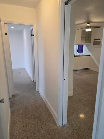 a view of a room with a hallway