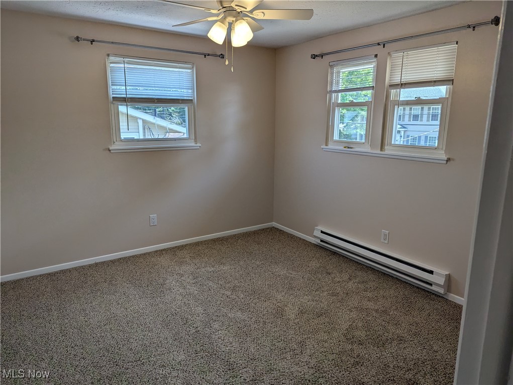 35286 Drake Street North Ridgeville, OH 44039 - Photo 18 of 24 2nd bedroomCarpeted spare room with ceiling fan and baseboard heating