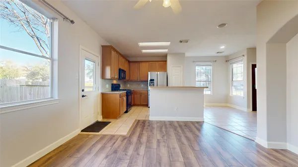 wooden floor in an empty room with a window and wooden floor